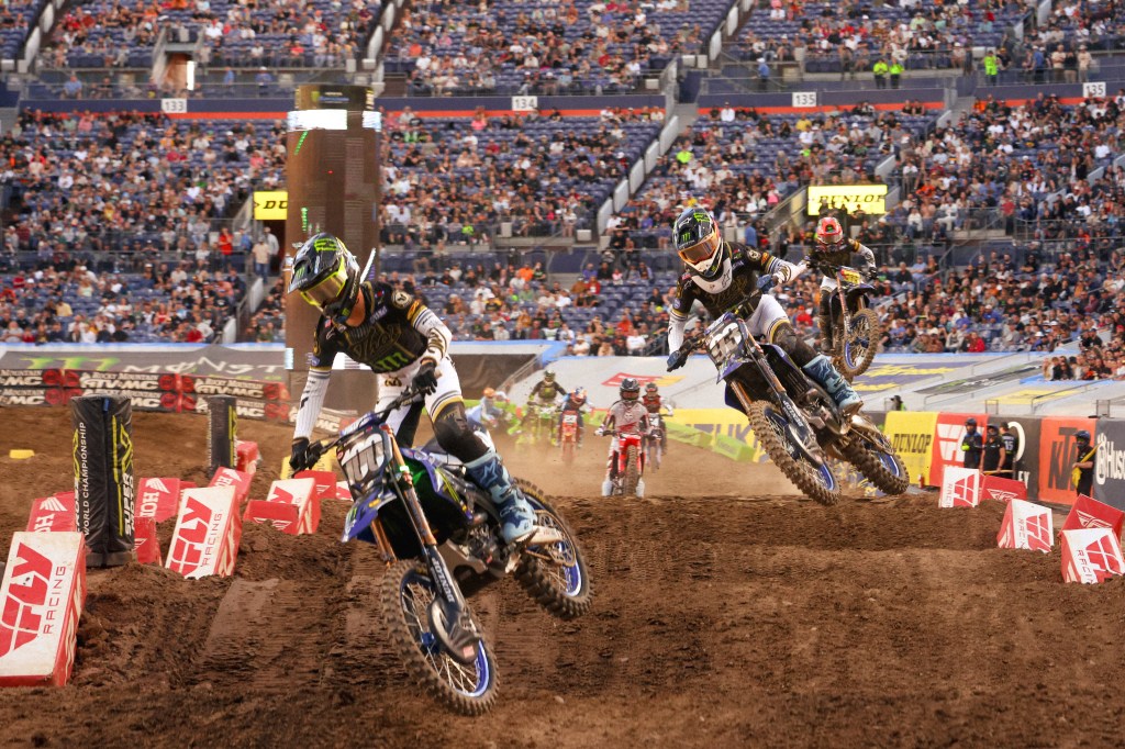 Cole Davies and Haiden Deegan mid-chase, both riders pushing aggressively.