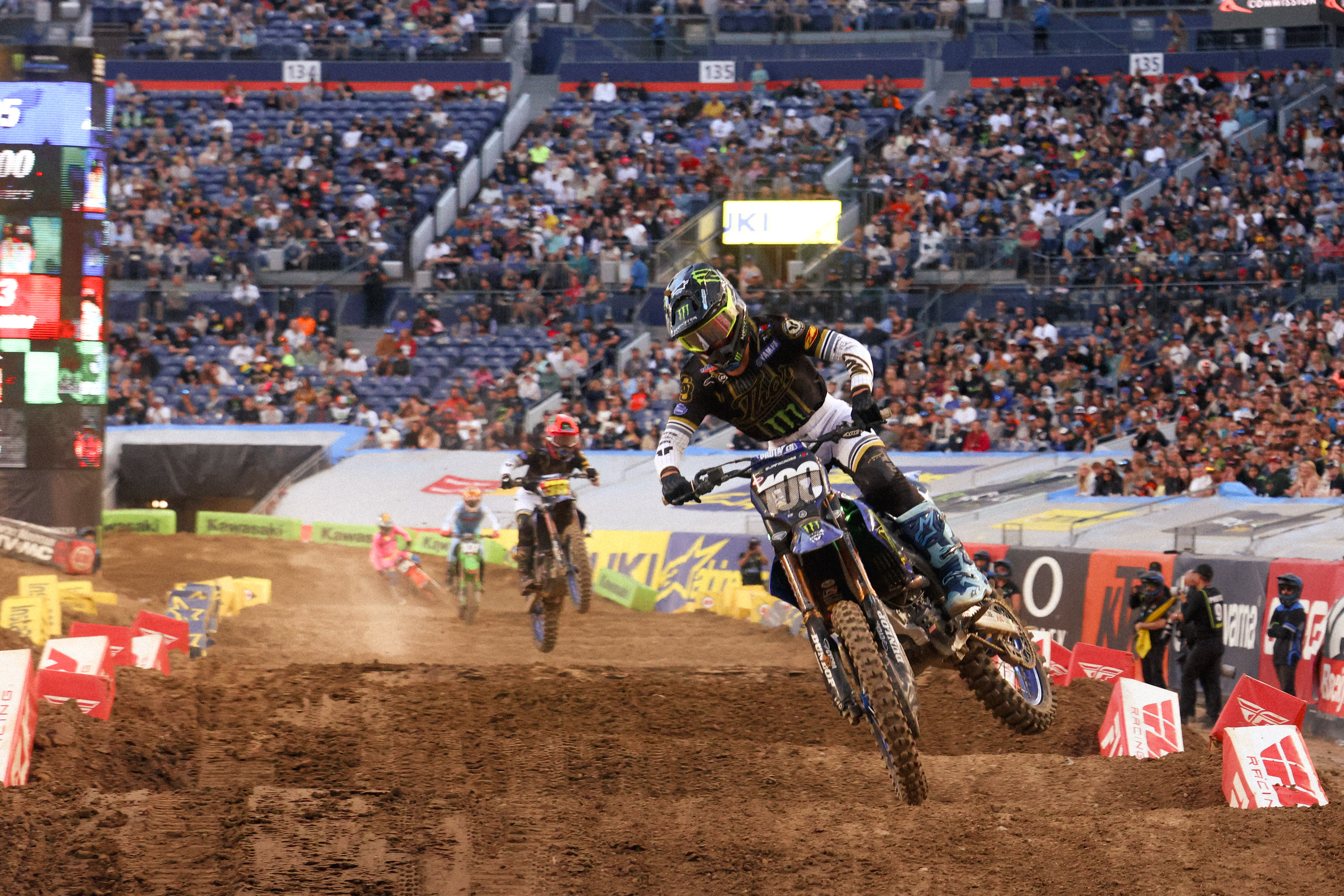 Cole Davies and Haiden Deegan mid-chase, both riders pushing aggressively.