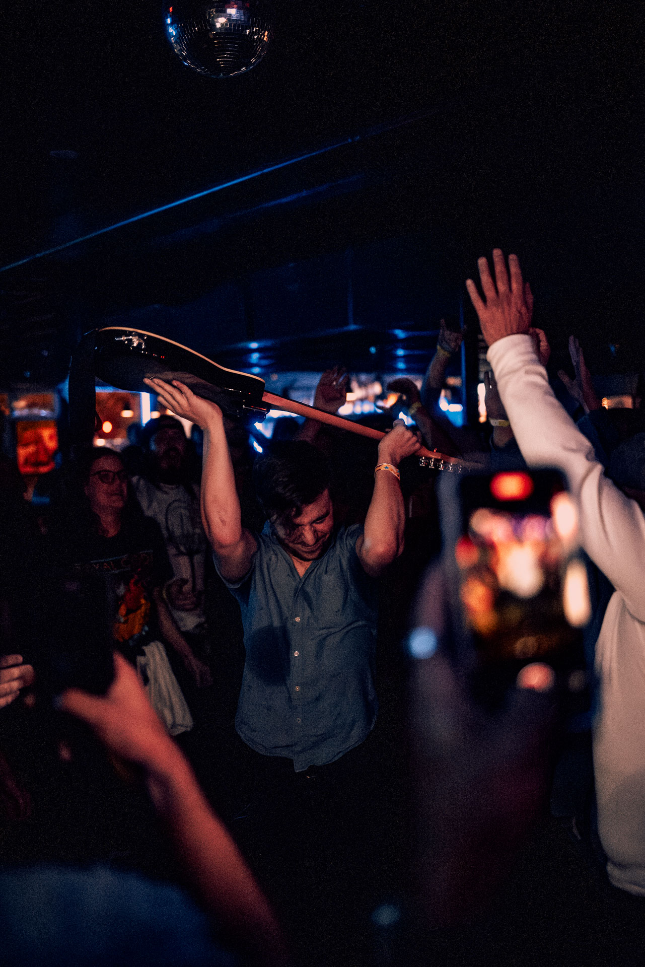 Greg Almeida coming out of the crowd after performing in the mosh pit in Denver, Colorado