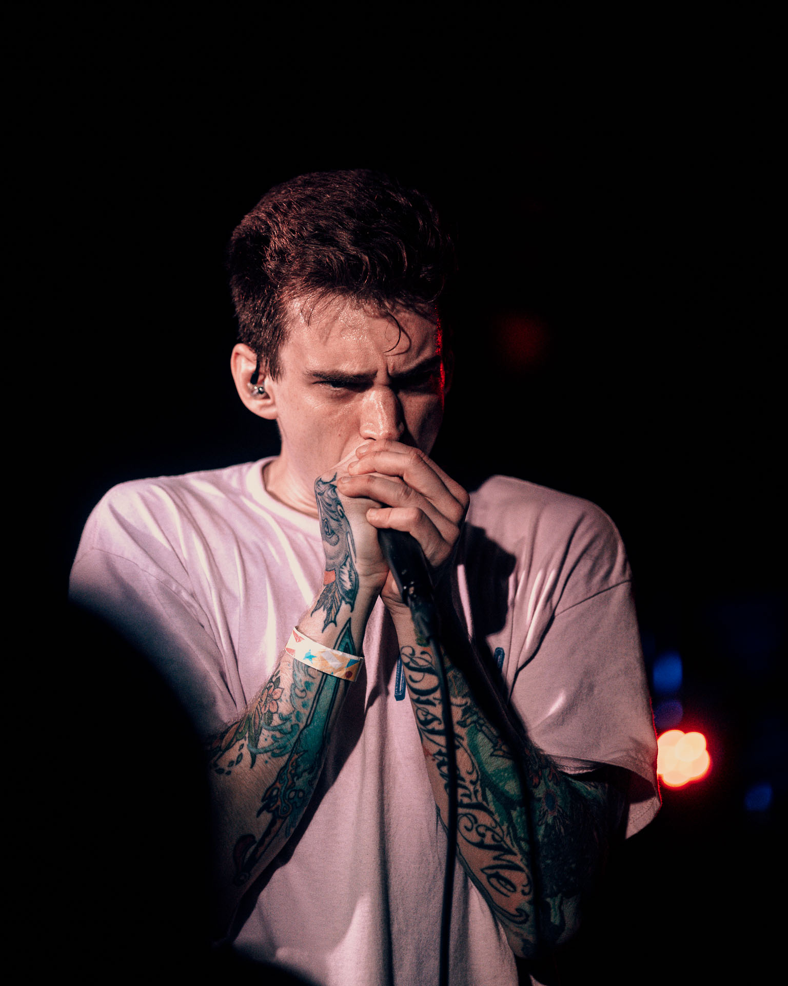 Andy Cizek screaming on stage during A Lot Like Birds concert