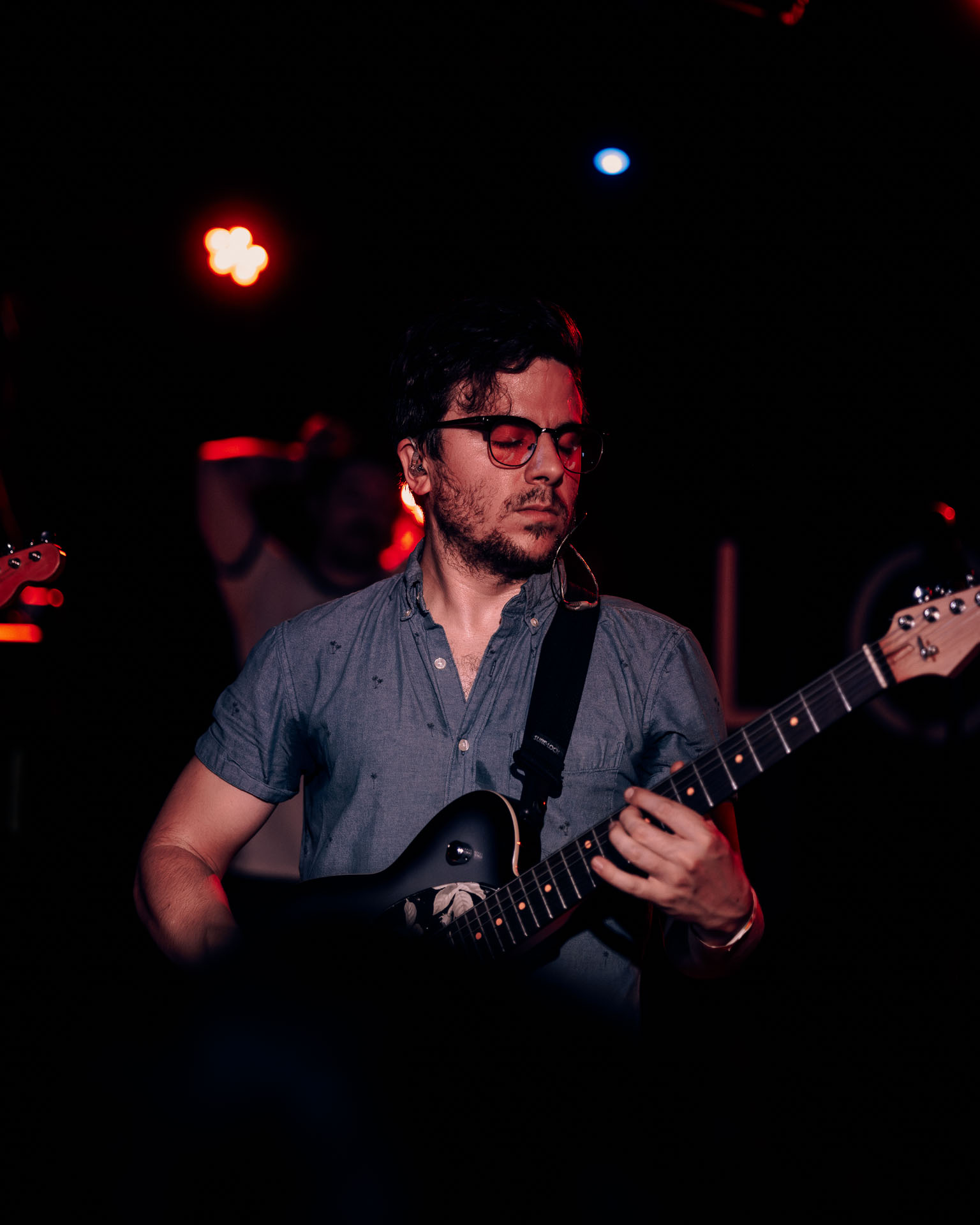 Greg Almeida performing lead guitar as a touring guitarist on A Lot Like Birds fall 2025 tour at HQ in Denver, Colorado