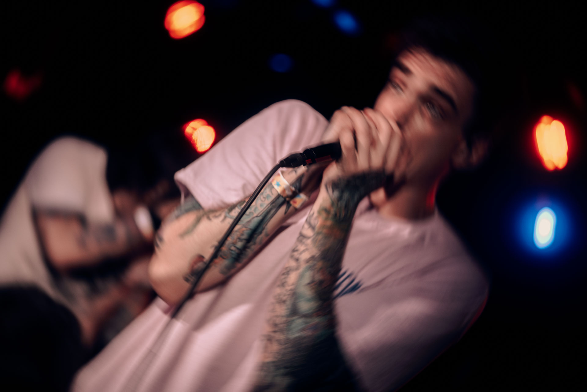 Andy Cizek screaming on stage during A Lot Like Birds concert