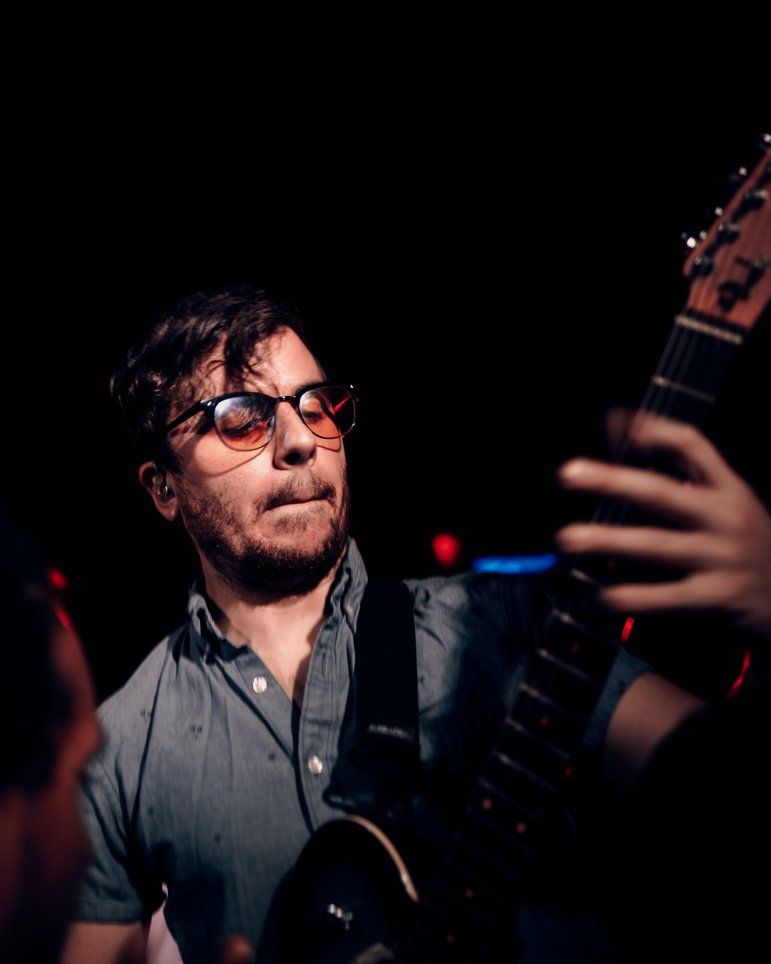 Greg Almeida performing lead guitar as a touring guitarist on A Lot Like Birds fall 2025 tour at HQ in Denver, Colorado
