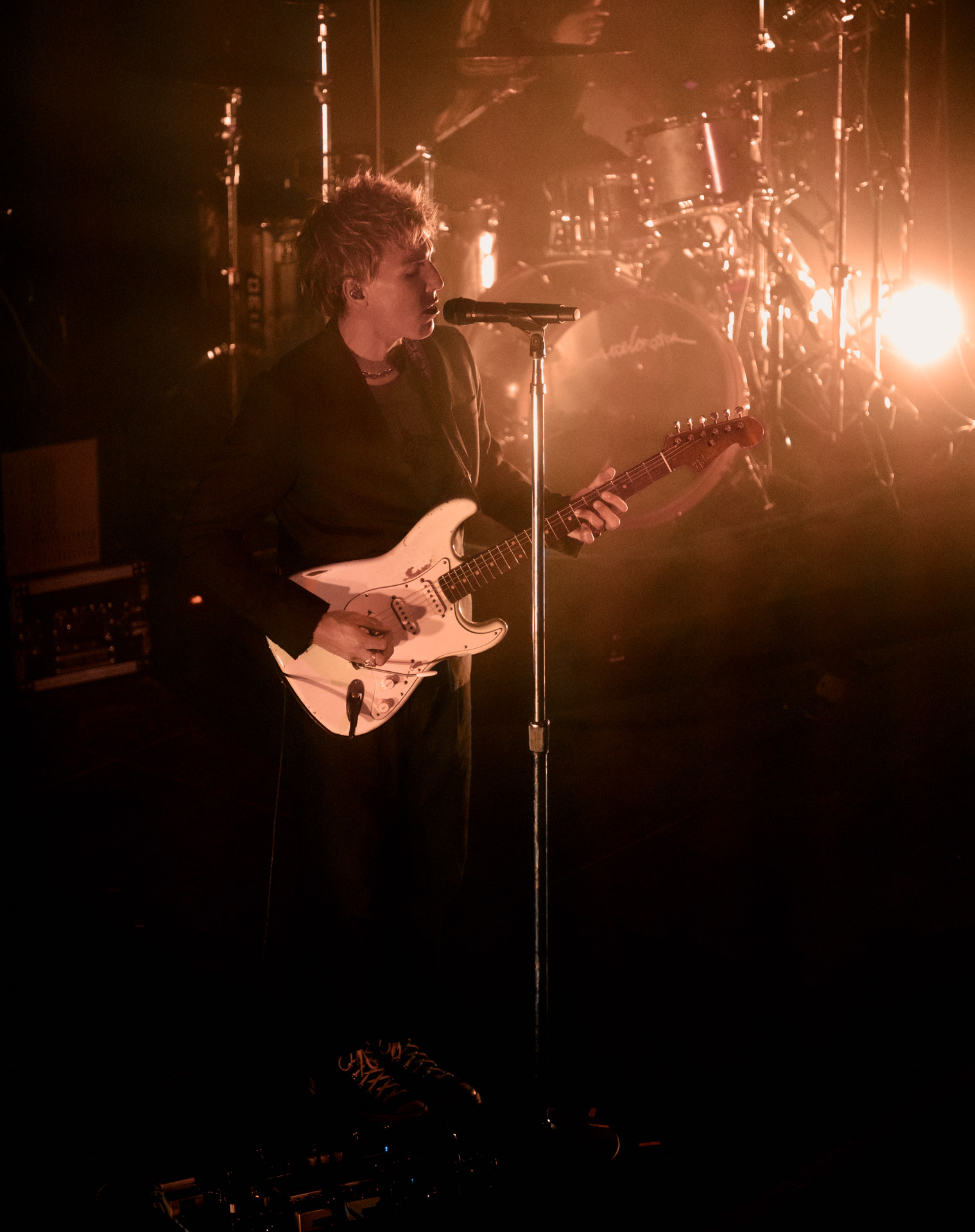 Christo Bowman from Bad Suns singing on stage in Denver, Colorado 2025