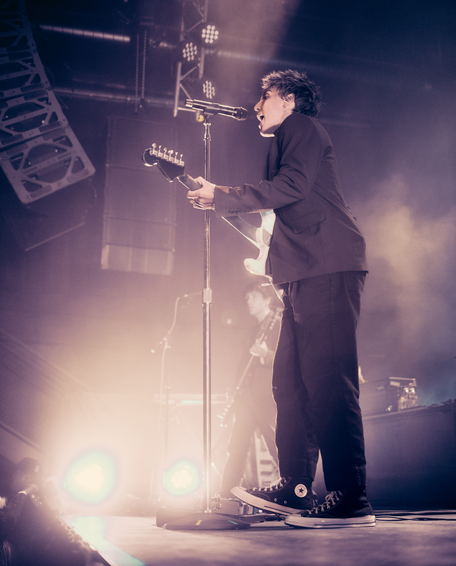 Christo Bowman singing on stage at Summit Music Hall in Denver, Colorado 2025 after lighting edits