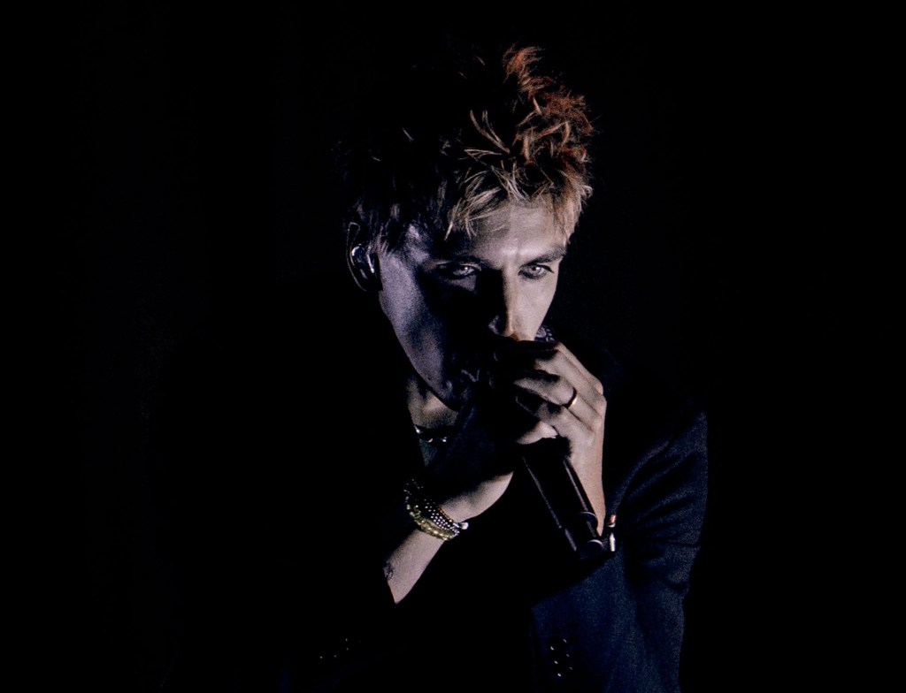 Christo Bowman from Bad Suns singing on stage in Denver, Colorado 2025, close up