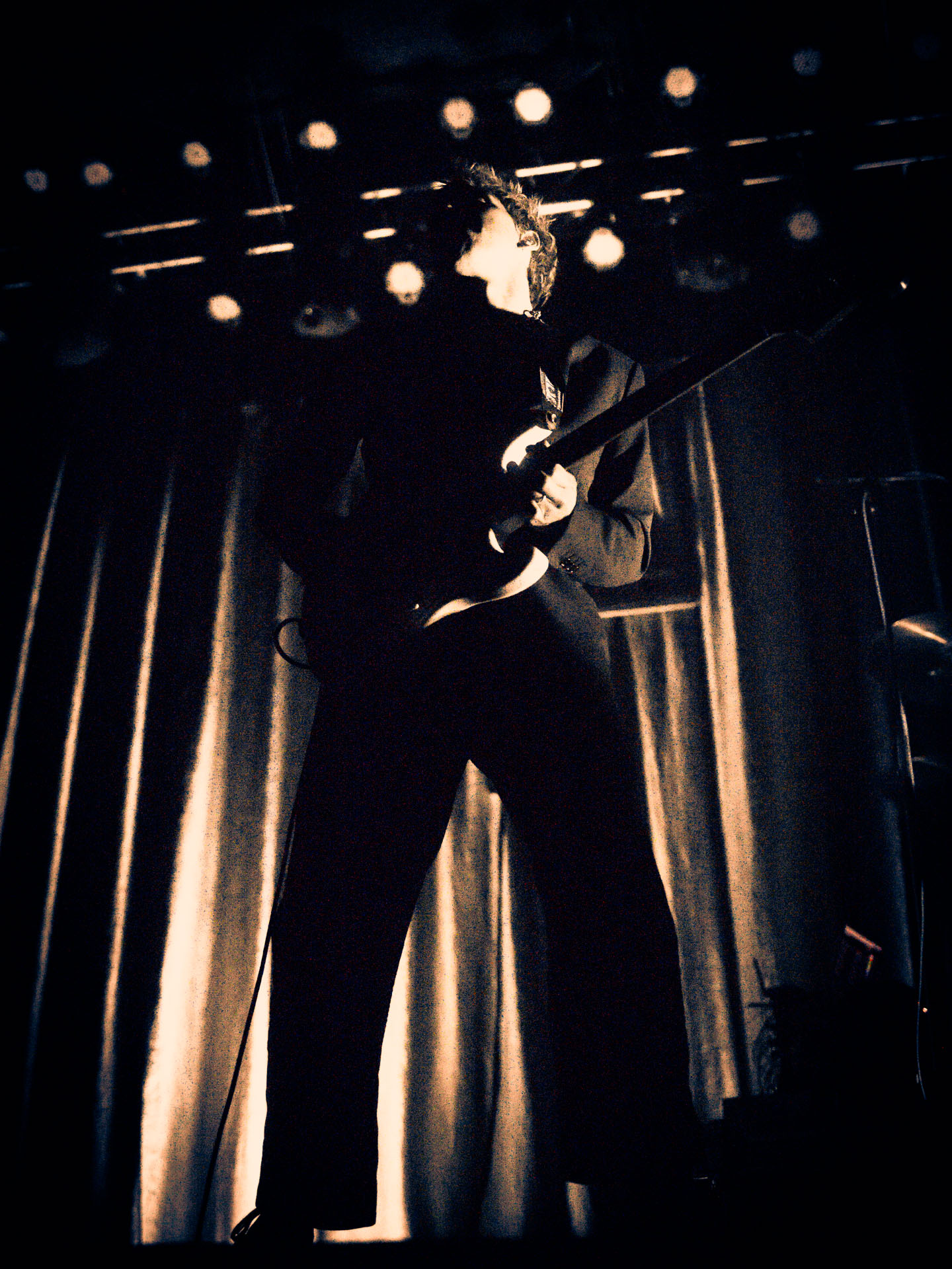 Christo Bowman from Bad Suns singing on stage in Denver, Colorado 2025, abstract