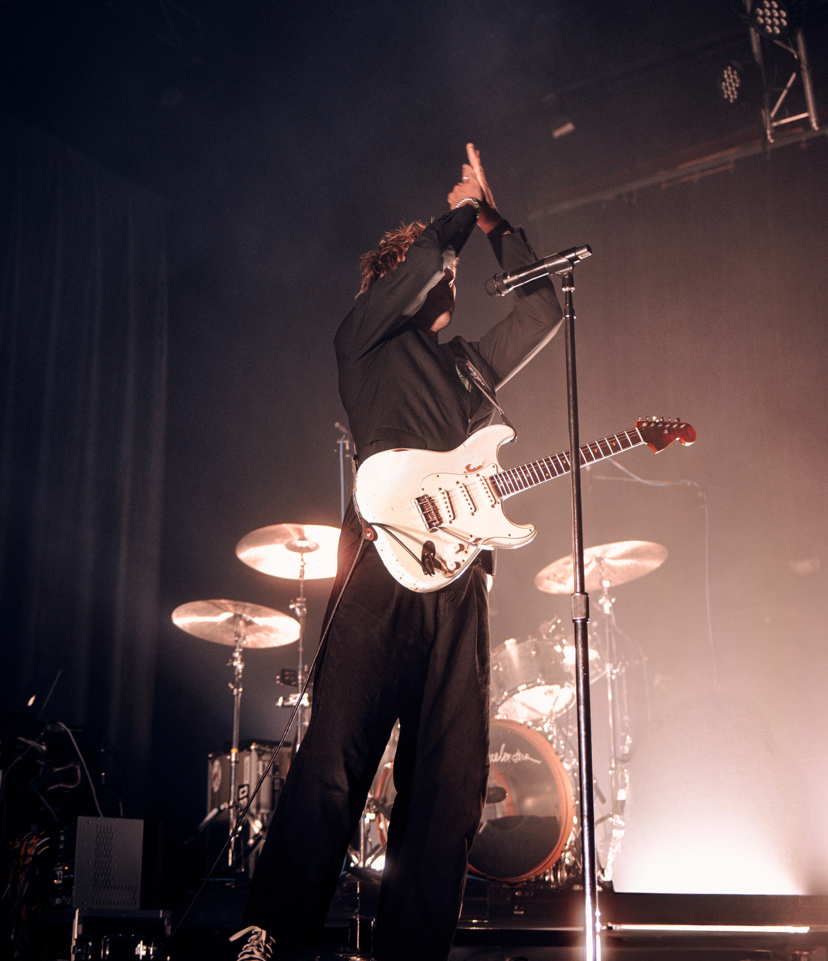 Christo Bowman from Bad Suns performing on stage in Denver, Colorado 2025