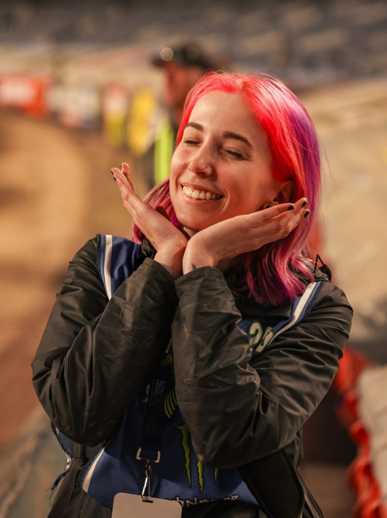 Kenedy Rae, writter and photographer behind KRX Media smiling at an event she is photographing