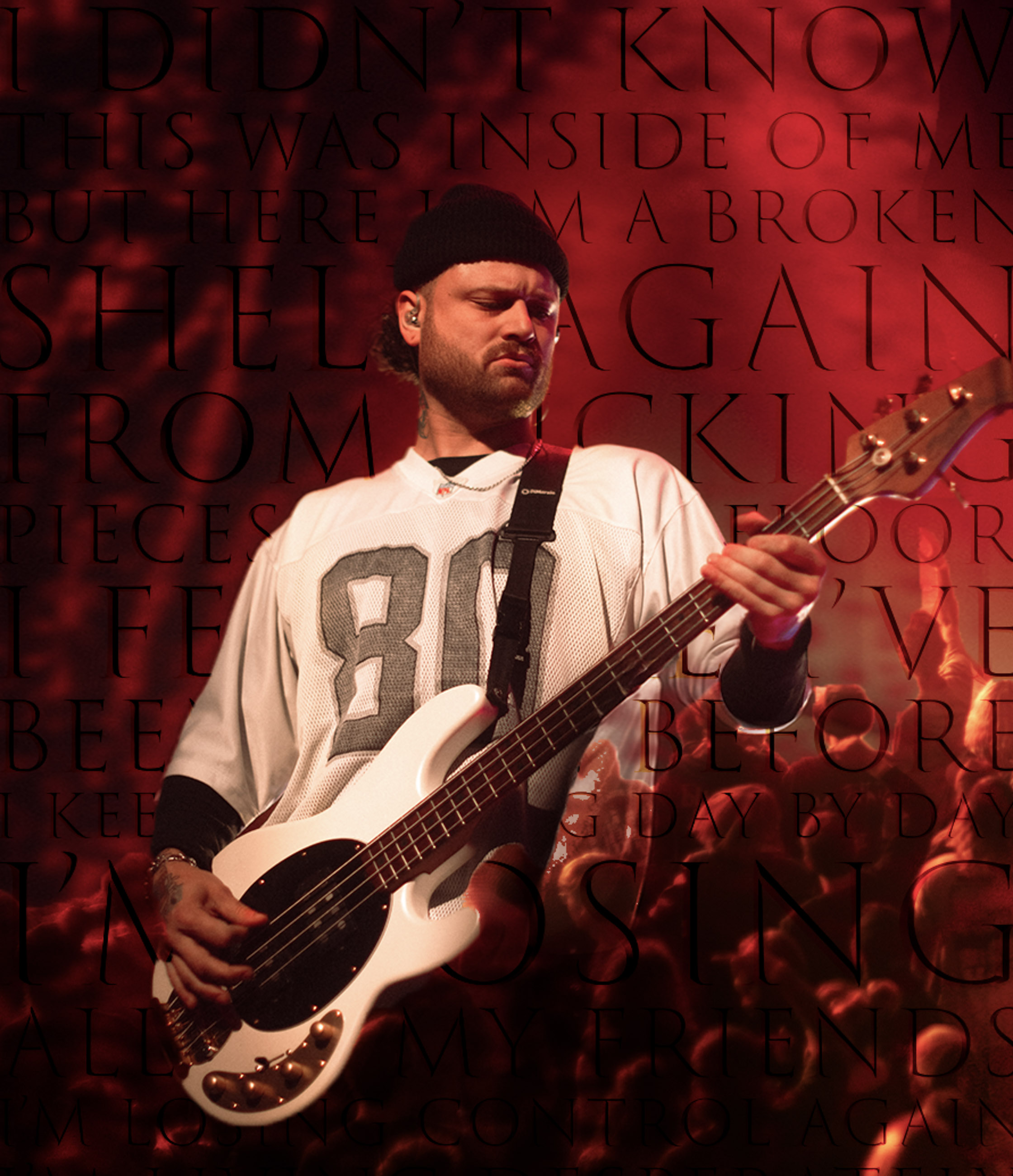 Belmont bassist playing under stage lights during a live performance in Denver, Colorado.